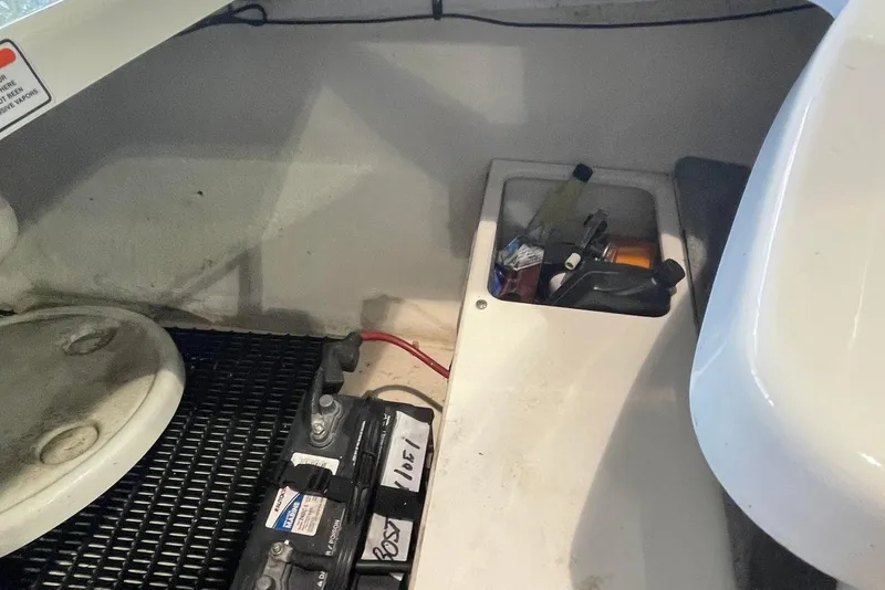 Slide: The Image of 2008 Monterey 214FS boat interior with battery and storage compartment. - 9