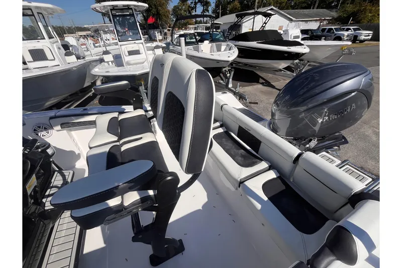 Slide: The Image of 2026 Tidewater 210 LXF boat with Yamaha engine, featuring sleek seating and modern design. - 13