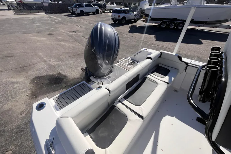 Slide: The Image of 2026 Tidewater 210 LXF boat interior with seating and outboard motor. - 4