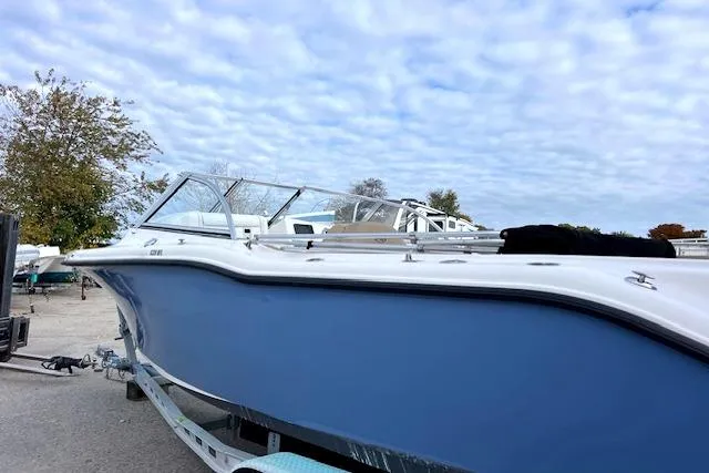 Slide: The Image of 2020 Key West 239 DFS boat on trailer under cloudy sky. - 3