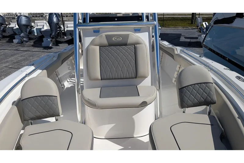 Slide: The Image of 2026 Key West 219 FS boat interior with gray cushioned seating. - 15