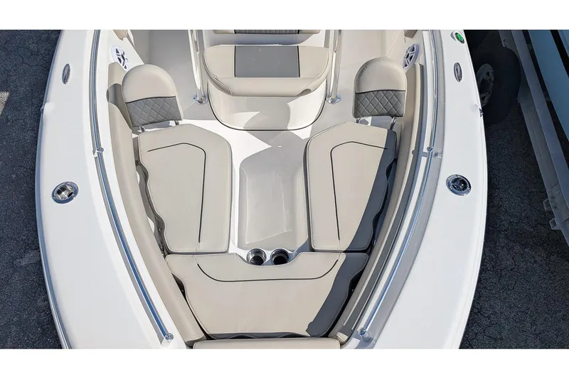 Slide: The Image of 2026 Key West 219 FS boat interior with cushioned seating and sleek design. - 17