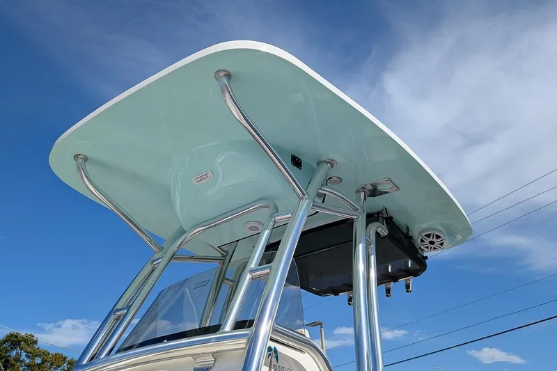 Slide: The Image of 2026 Key West 219 FS boat T-top against a clear blue sky. - 20