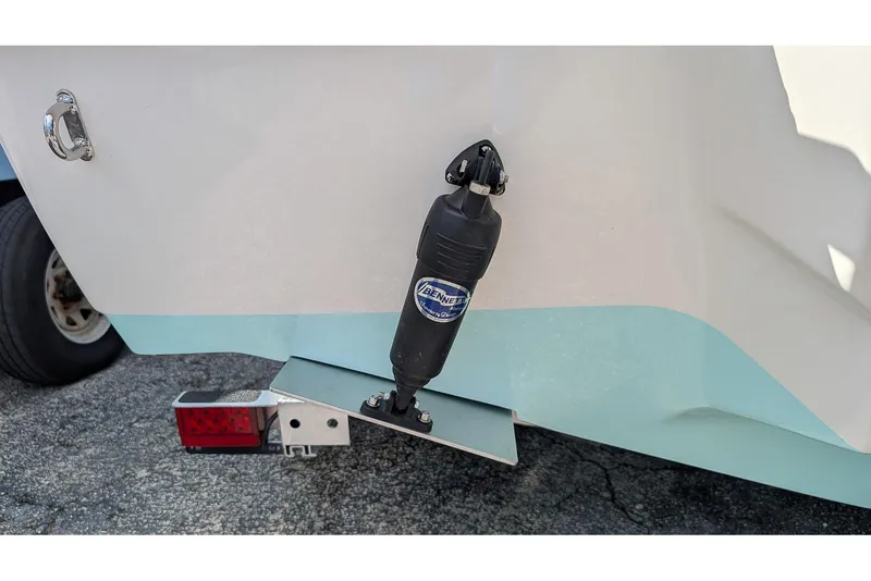 Slide: The Image of 2026 Key West 219 FS boat with Bennett trim tab on trailer. - 5