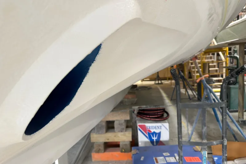 Slide: The Image of 2025 Calvin Beal Sedan under construction in a workshop setting. - 12
