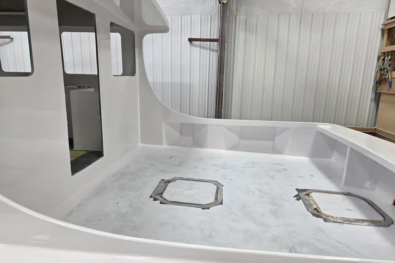 Slide: The Image of 2025 Calvin Beal Sedan interior under construction in a workshop setting. - 13