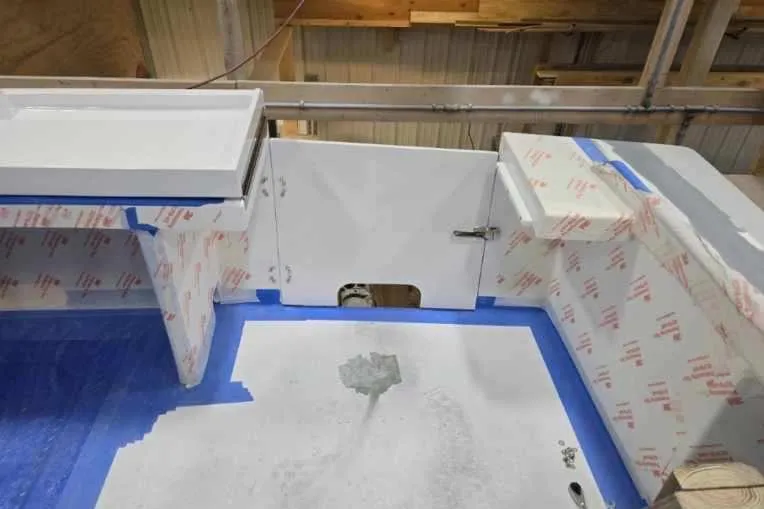 Slide: The Image of 2025 Calvin Beal Sedan interior under construction, featuring white panels and blue tape accents. - 17