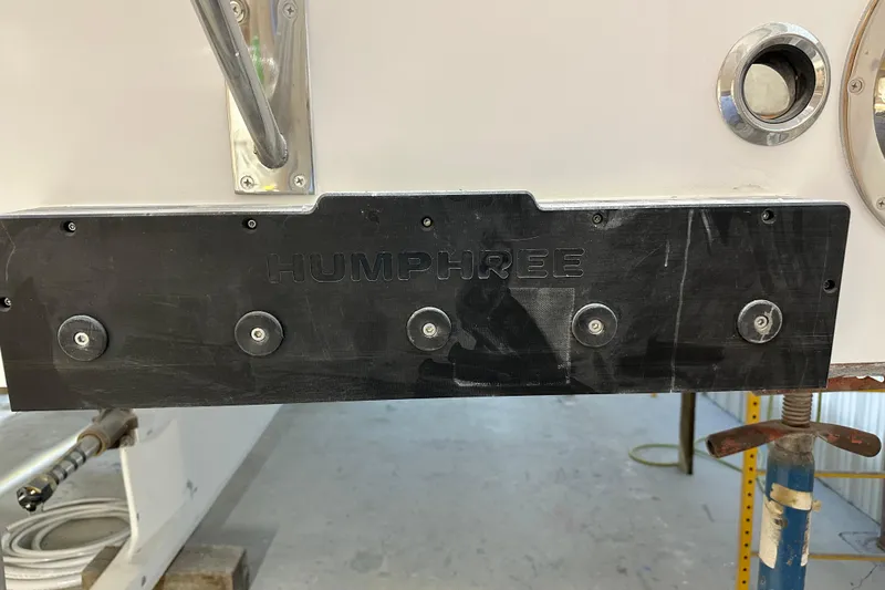 Slide: The Image of Close-up of Humphree trim system on a 2025 Calvin Beal Sedan boat. - 23