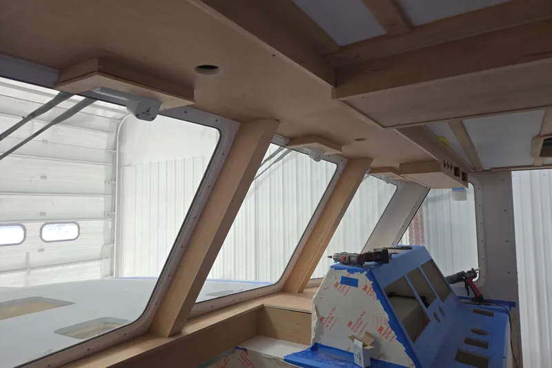 Slide: The Image of Interior view of a 2025 Calvin Beal Sedan boat under construction. - 29