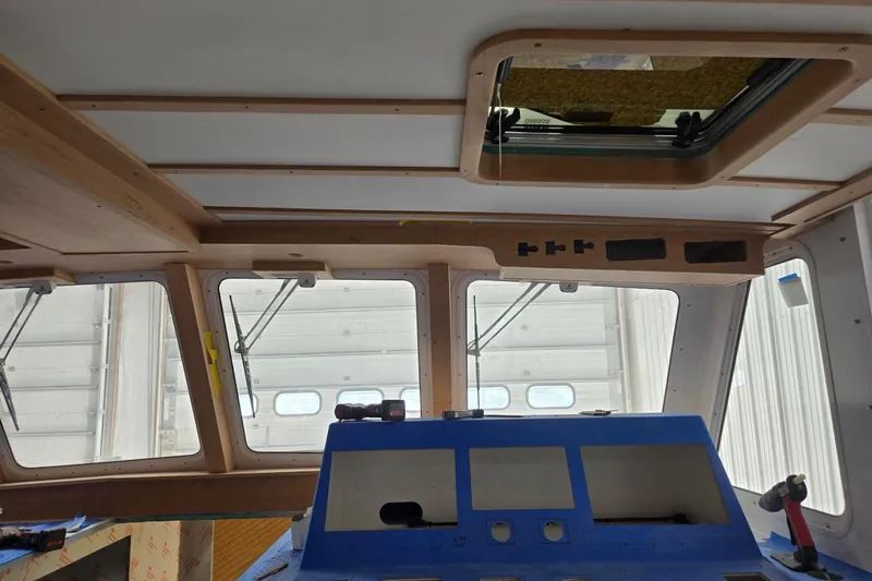 Slide: The Image of Interior view of a 2025 Calvin Beal Sedan, showcasing dashboard and windows. - 30