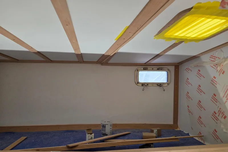 Slide: The Image of Interior renovation of 2025 Calvin Beal Sedan with wooden beams and window. - 42