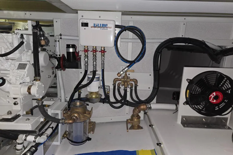Slide: The Image of Engine room of a 2025 Calvin Beal Sedan with mechanical components and wiring. - 56