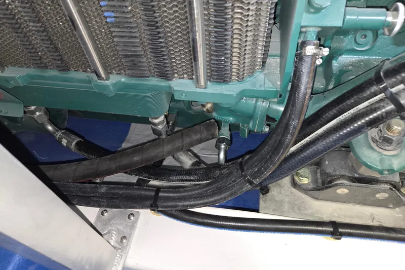 Slide: The Image of Close-up of 2025 Calvin Beal Sedan engine components and hoses. - 63
