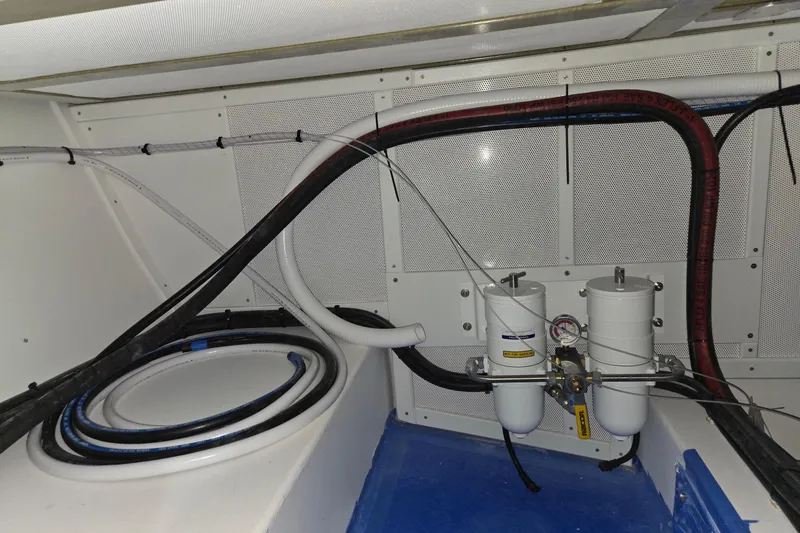 Slide: The Image of Engine compartment of 2025 Calvin Beal Sedan with fuel filters and hoses. - 67