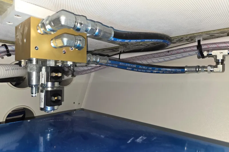 Slide: The Image of Hydraulic system components in a 2025 Calvin Beal Sedan, featuring hoses and connectors. - 68