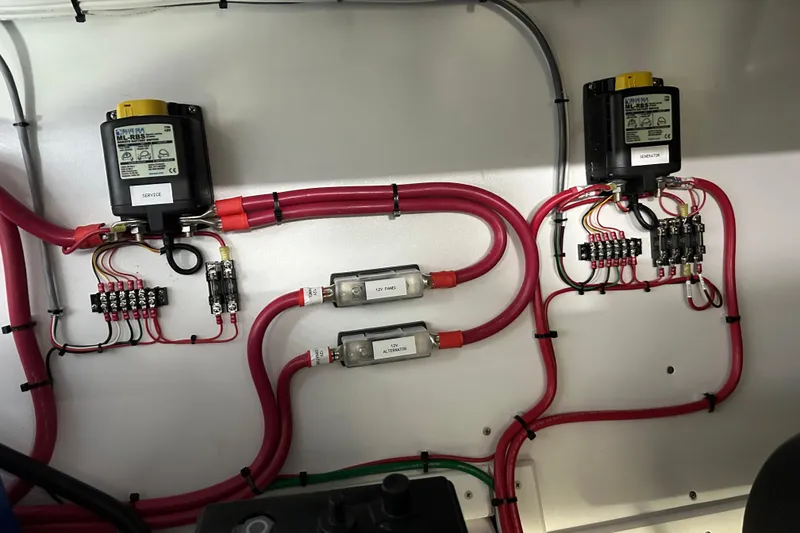 Slide: The Image of Electrical wiring setup in a 2025 Calvin Beal Sedan, featuring fuses and relays. - 88