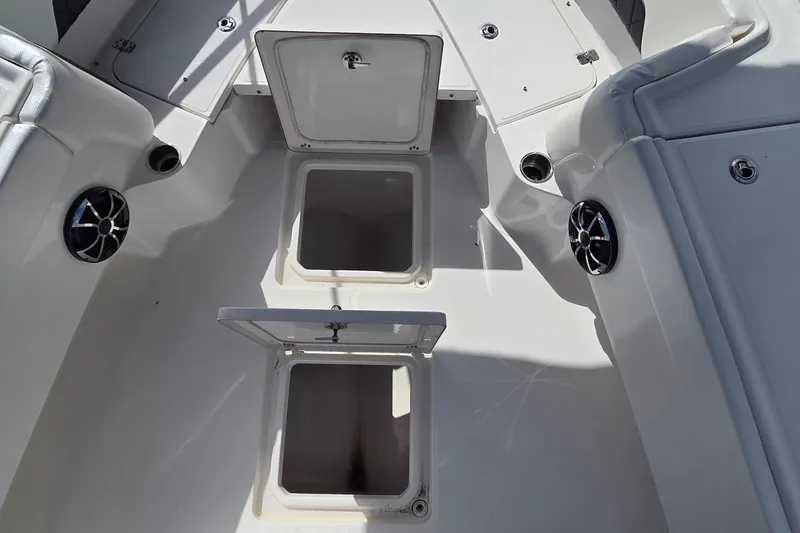 Slide: The Image of 2020 Blue Wave 2800 Makaira boat interior with open storage compartments. - 10