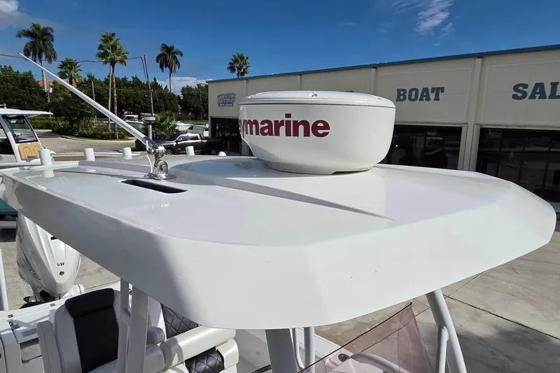 Slide: The Image of 2020 Blue Wave 2800 Makaira boat with radar, parked at dealership. - 11