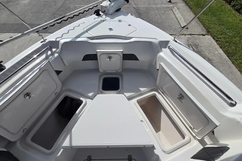 Slide: The Image of 2020 Blue Wave 2800 Makaira boat deck with open storage compartments. - 12