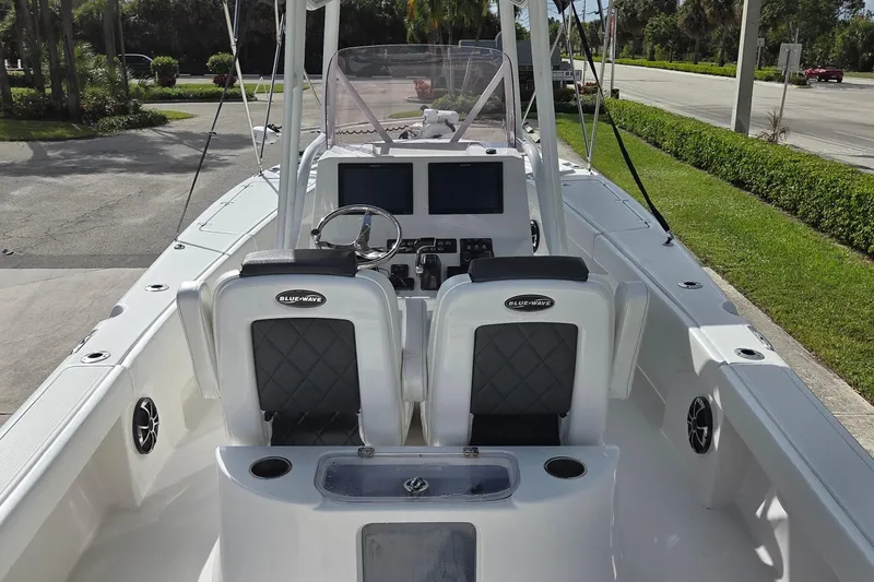 Slide: The Image of 2020 Blue Wave 2800 Makaira boat interior with dual seats and control panel. - 18