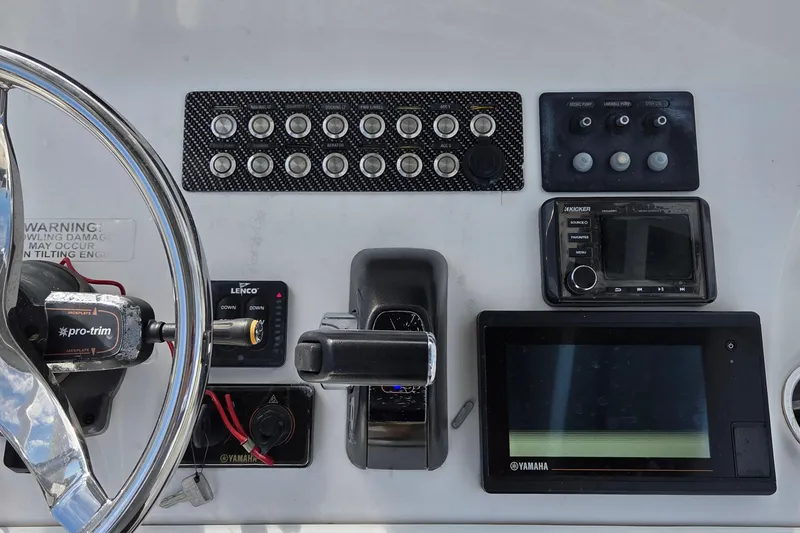 Slide: The Image of Control panel of 2020 Blue Wave 2800 Makaira boat with steering wheel and electronic displays. - 5