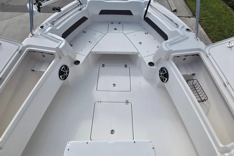 Slide: The Image of Interior view of 2020 Blue Wave 2800 Makaira boat, featuring spacious seating and storage. - 6