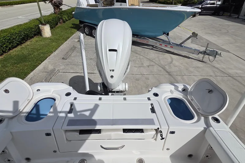 Slide: The Image of 2020 Blue Wave 2800 Makaira boat with open compartments and powerful engine. - 8