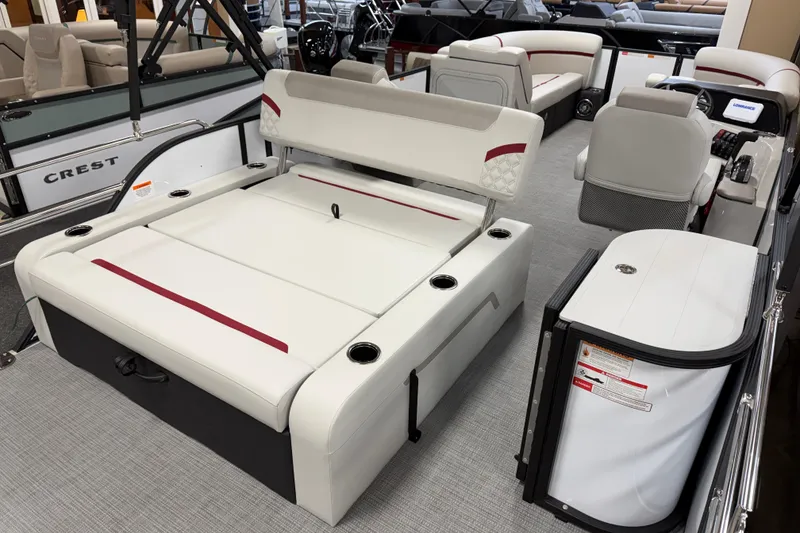 Slide: The Image of 2026 Crest Conquest 230 SLSC pontoon boat interior with luxurious seating and modern design. - 11