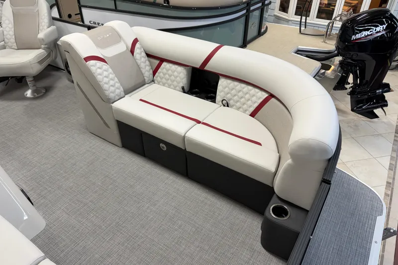 Slide: The Image of Luxurious seating on 2026 Crest Conquest 230 SLSC pontoon boat, featuring elegant upholstery and modern design. - 2