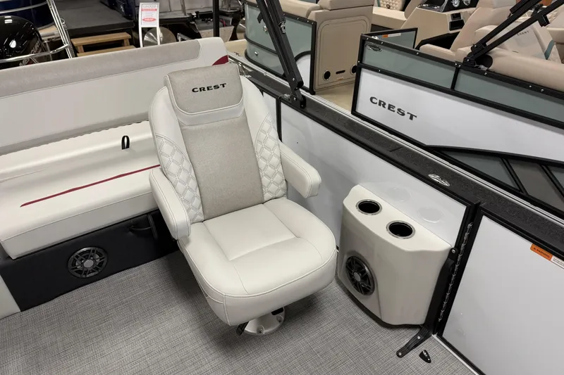 Slide: The Image of Luxurious seating on 2026 Crest Conquest 230 SLSC boat, featuring cup holders and premium upholstery. - 7
