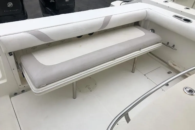 Slide: The Image of 2009 Boston Whaler 320 Outrage Cuddy Cabin interior seating area. - 11