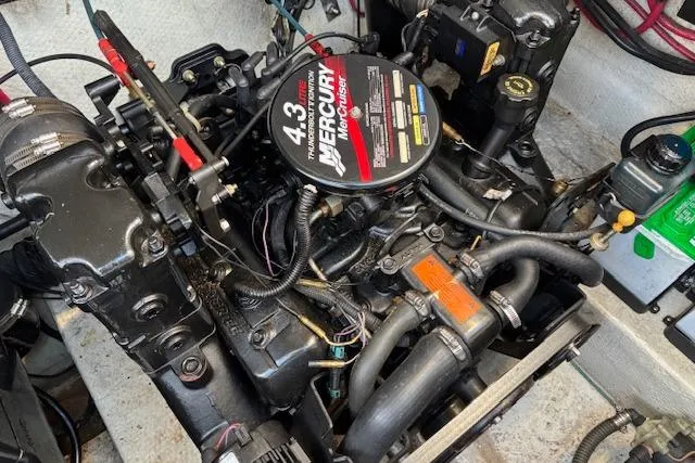 Slide: The Image of Engine of a 2002 Regal Commodore 2765 boat, featuring a Mercury 4.3L motor. - 17