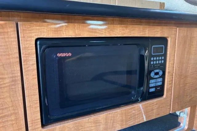 Slide: The Image of Built-in microwave in 2002 Regal Commodore 2765 boat kitchen. - 29