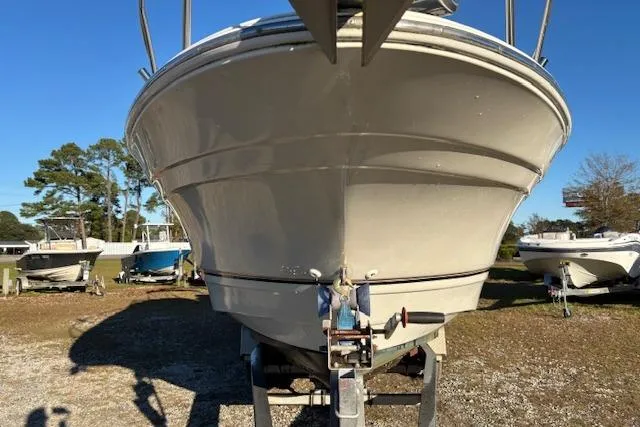 Slide: The Image of 2002 Regal Commodore 2765 boat on trailer, front view, outdoors, sunny day. - 3