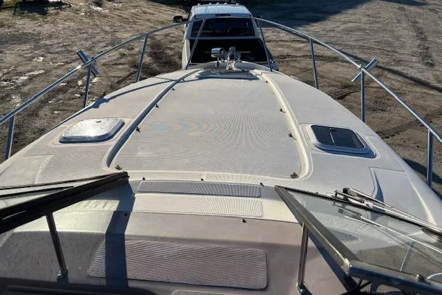 Slide: The Image of 2002 Regal Commodore 2765 boat on trailer, viewed from above, showing deck and railings. - 35