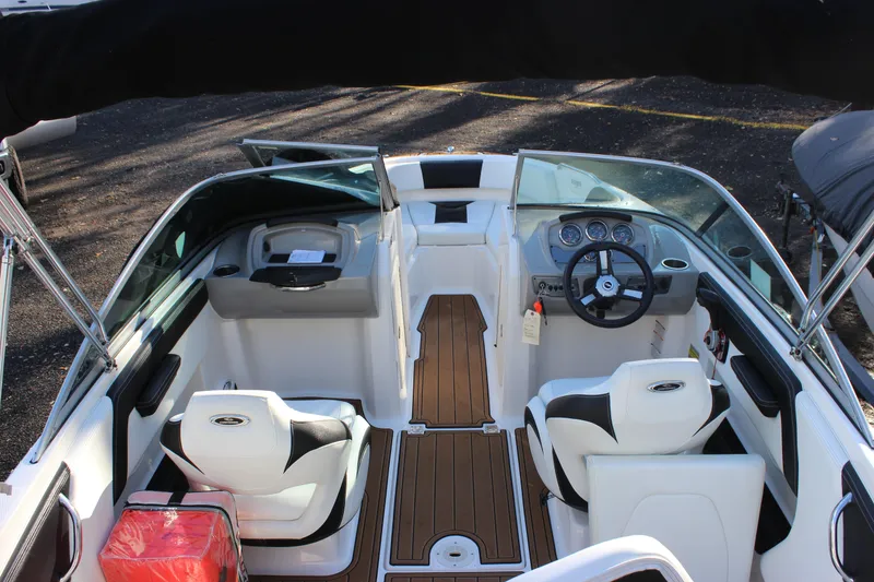 Slide: The Image of 2017 Chaparral 21 H2O Ski & Fish boat interior with steering wheel and seating. - 22