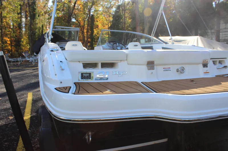 Slide: The Image of 2017 Chaparral 21 H2O Ski & Fish boat with deluxe features, parked outdoors. - 25