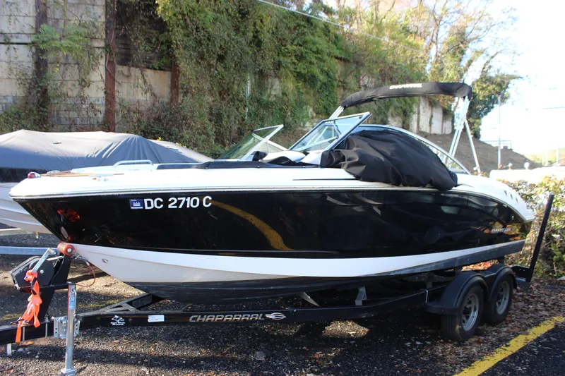 Slide: The Image of 2017 Chaparral 21 H2O Ski & Fish boat on trailer, parked outdoors. - 3