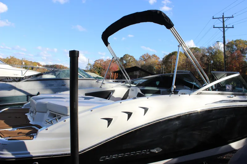 Slide: The Image of 2017 Chaparral 21 H2O Ski & Fish boat docked under clear blue sky. - 32