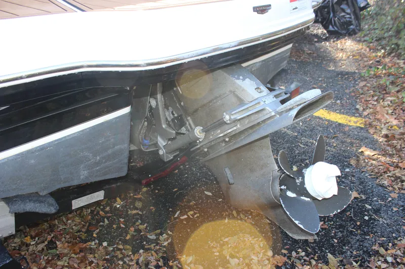 Slide: The Image of 2017 Chaparral 21 H2O Ski & Fish boat propeller and stern, surrounded by autumn leaves. - 34