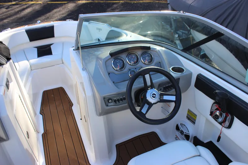 Slide: The Image of 2017 Chaparral 21 H2O Ski & Fish boat interior with steering wheel and dashboard. - 4