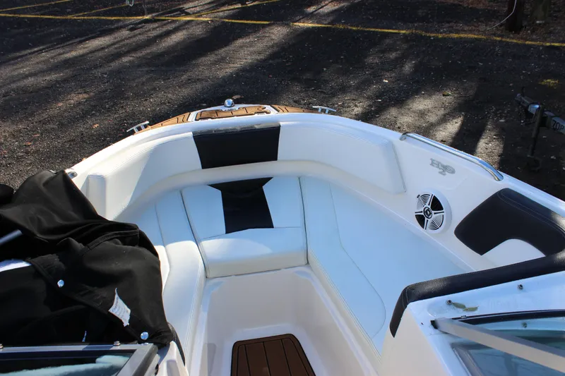 Slide: The Image of 2017 Chaparral 21 H2O Ski & Fish boat interior with white seating and speaker. - 6