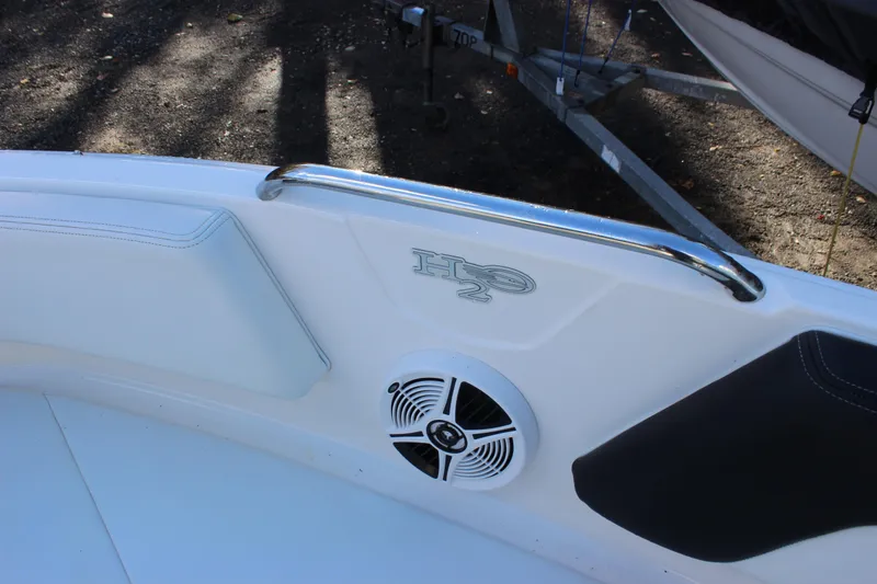 Slide: The Image of 2017 Chaparral 21 H2O Ski & Fish boat interior with speaker and railing. - 7