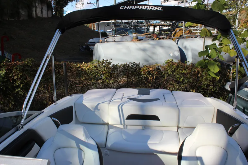 Slide: The Image of 2017 Chaparral 21 H2O Ski & Fish boat interior with seating and canopy. - 8