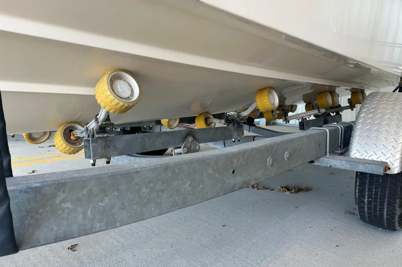 Slide: The Image of Trailer with yellow rollers supporting a 1995 Grady-White Tournament 192 boat. - 11