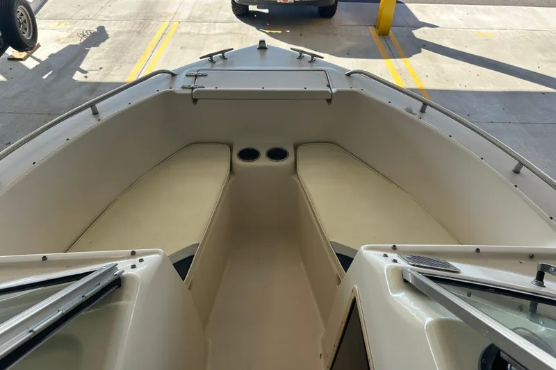 Slide: The Image of 1995 Grady-White Tournament 192 boat interior with seating and cup holders. - 14