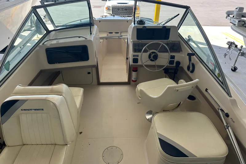 Slide: The Image of 1995 Grady-White Tournament 192 boat interior with steering wheel and seating. - 18