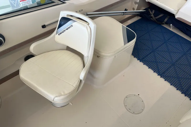 Slide: The Image of 1995 Grady-White Tournament 192 boat interior with seating and blue mat. - 19