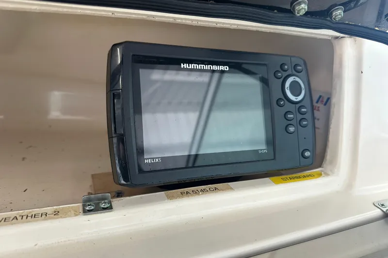 Slide: The Image of Humminbird Helix 5 GPS device on 1995 Grady-White Tournament 192 boat dashboard. - 22