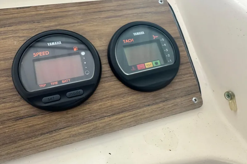 Slide: The Image of Yamaha speed and tachometer gauges on 1995 Grady-White Tournament 192 boat dashboard. - 24